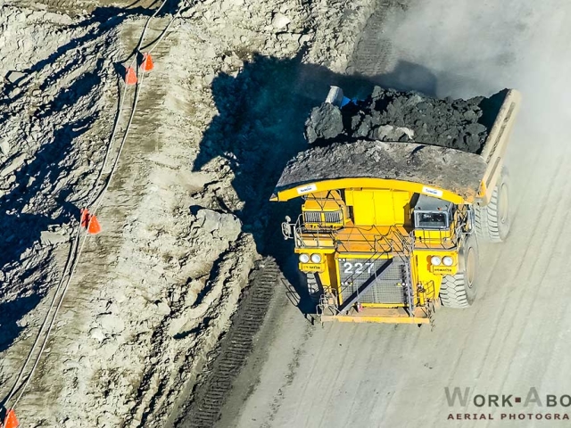 Aerial photo of oil sands truck hauling bitumen